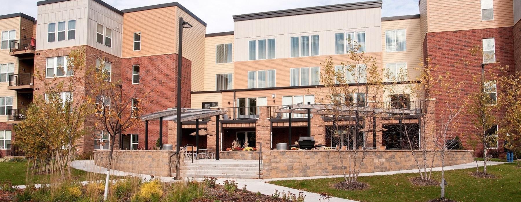 a building with a garden in front